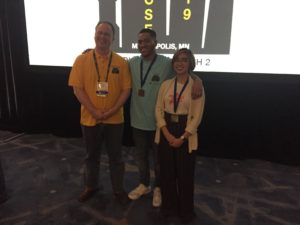 CS Junior Shm Almeda with two other people at the ACM Student Research Contest